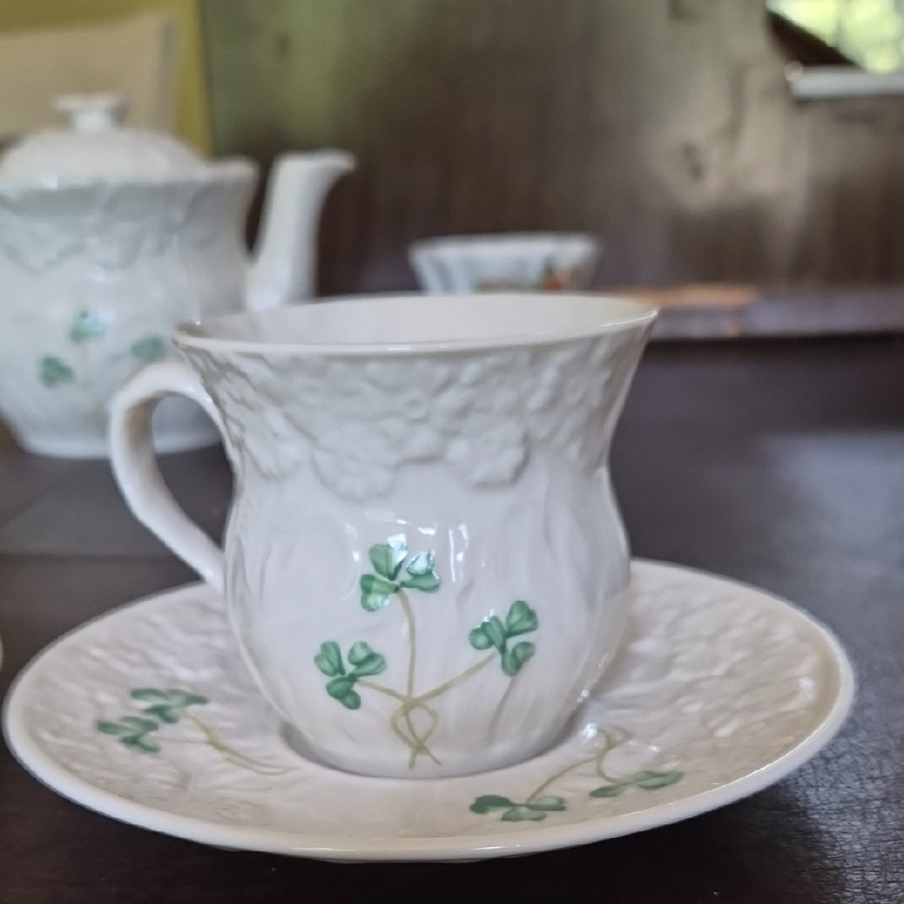 Belleek Ivory Teacup and Saucer with Green Accents